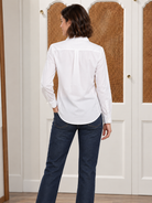 The Lomas Brand Abigail Oxford Shirt in white — back view showing center pleat and curved hem