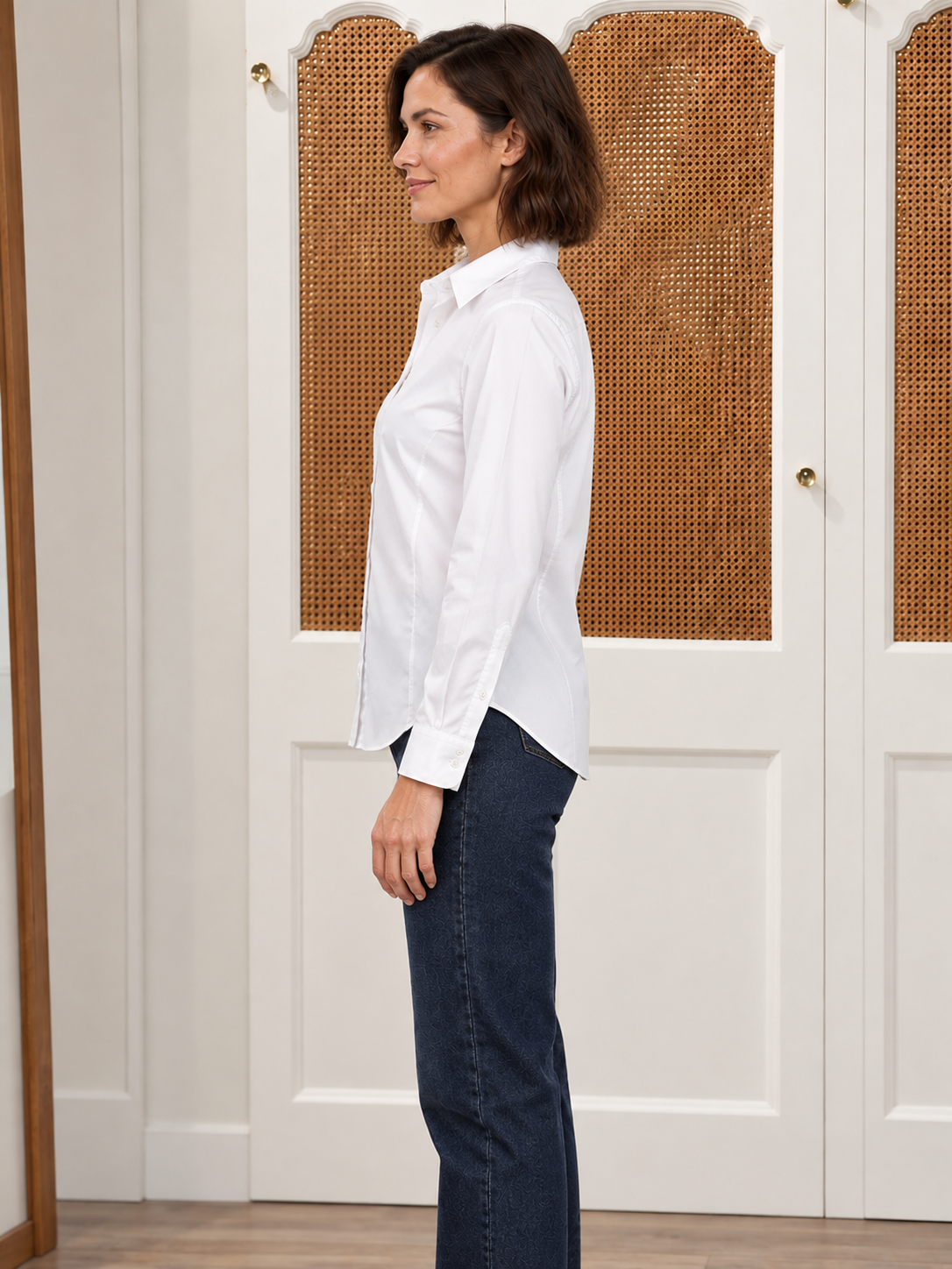 The Lomas Brand Abigail Oxford Shirt in white — side view showing oversized silhouette and curved hem