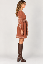 Cecilia Dress by Marigold in brown Maple Canopy print, side view showing V-neck, button front, and tie waist