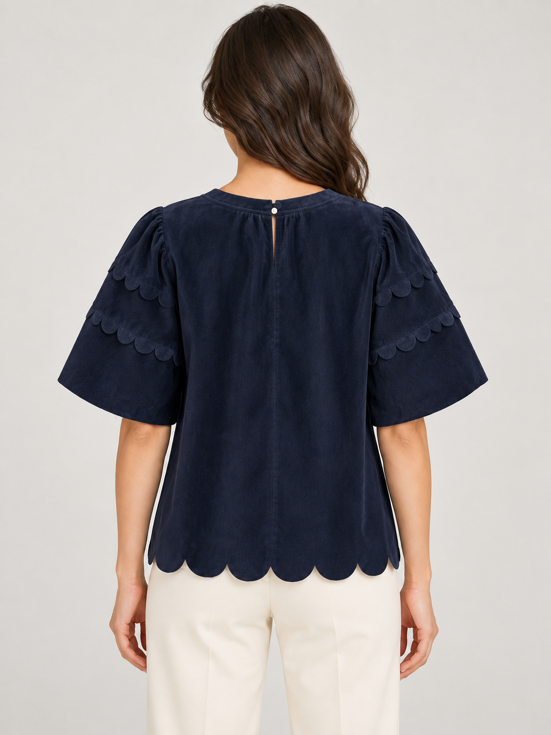 Greer Top by Voy in navy corduroy with bubble sleeves, scalloped trim and a scalloped hem
