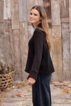 Wooden Ships Tigress Sweater in black — wool-blend knit with ribbed cuffs and side slit, side view 