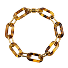 Gold Paperclip Chain and Tortoise Link Bracelet by Ali Bird, product view, alternating gold and tortoise resin oval links with gold barrel clasp
