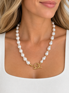 Baroque Pearl and Gold Necklace by Marj & Lizzie, white baroque pearls with gold toggle clasp, worn front view