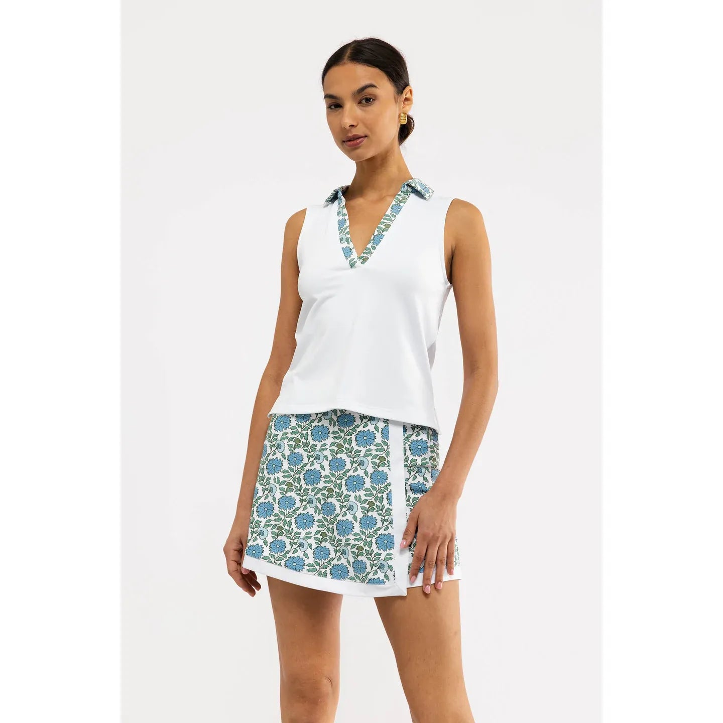 White floral Bryce Polo top by Smith & Quinn, featuring a stylish short-sleeve design with a floral pattern.