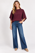 Eloise Top by Entro in merlot, front view showing round neckline, center seam, and wide draped sleeves. D31013

