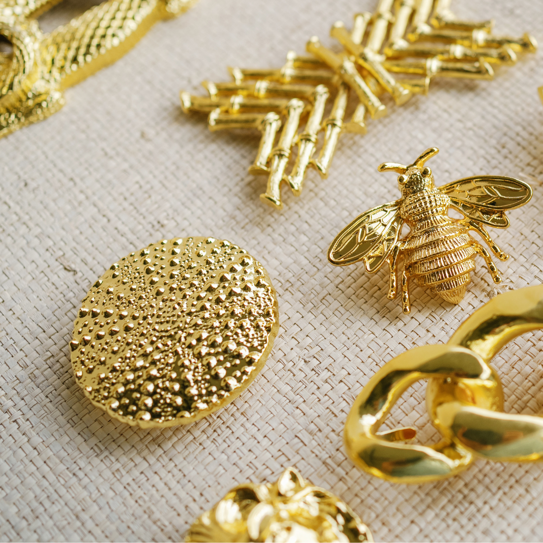 Pebbled Disc Belt Buckle gold textured disc detail, flat lay with gold accessories - Marj & Lizzie
