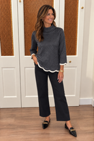 Bennett Sweater by Fate in charcoal shimmer knit with a mock neck and ivory-trimmed scalloped cuffs and hem, front view