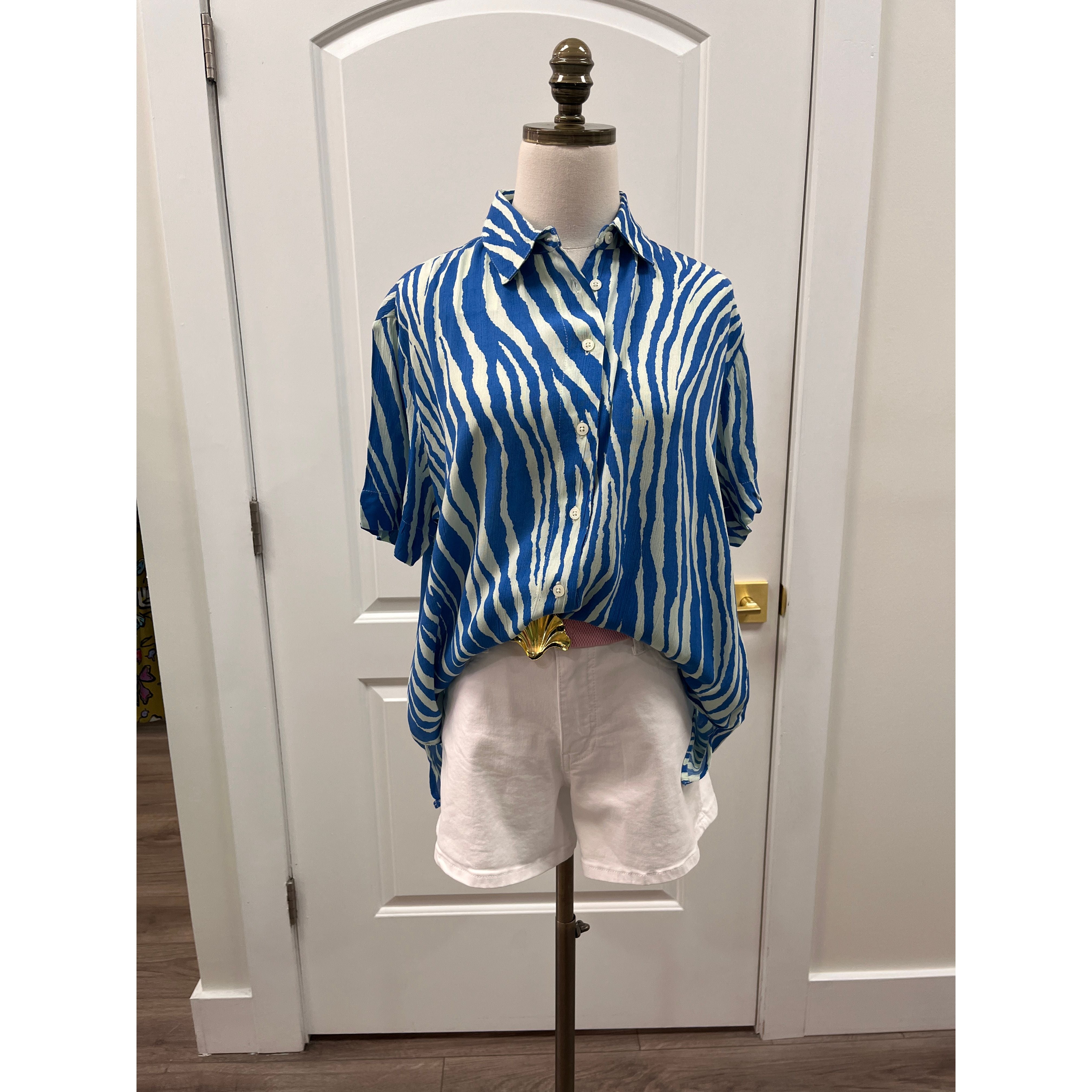 Elan Francesca top in blue zebra print with short sleeves and button-down front, casual and stylish women’s top.