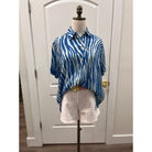 Elan Francesca top in blue zebra print with short sleeves and button-down front, casual and stylish women’s top.