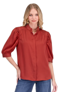 Callie Top by Jade in apple red — puff sleeve button-front top with band collar and concealed placket, close-up front view