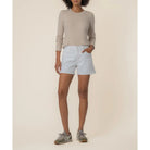 Jane high-rise jean shorts in optic white by Kut from the Kloth, shown on a model with a casual fit and distressed detailing.