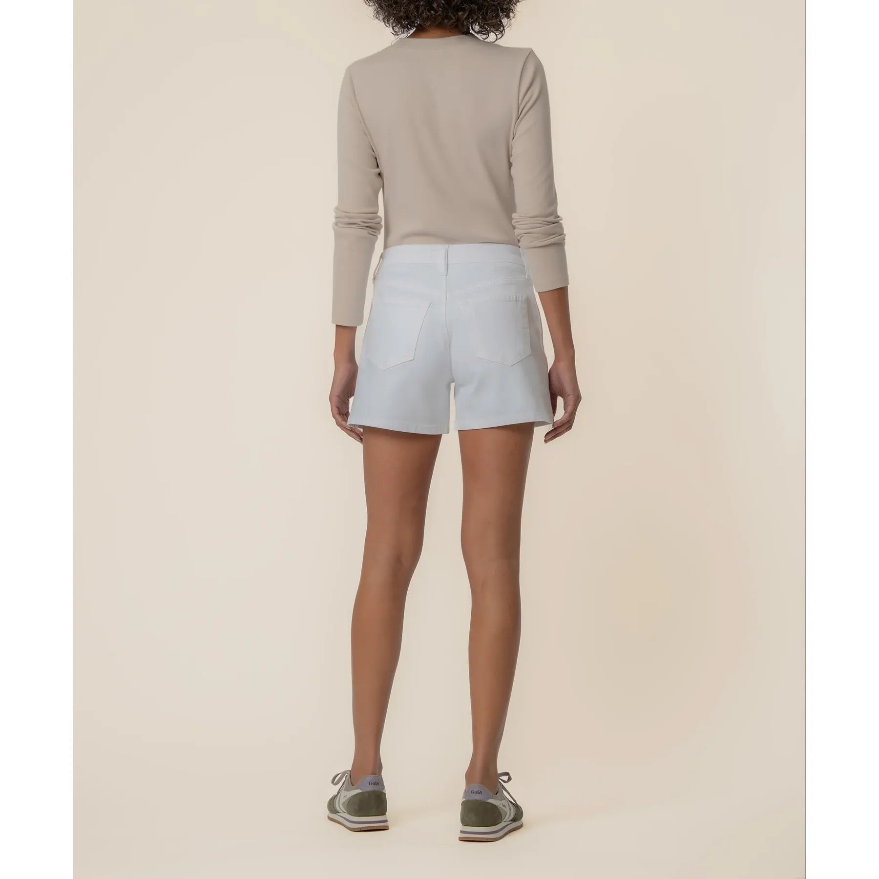 Jane high rise jean shorts in optic white by Kut from the Kloth, shown on a model with a close-up of the denim fabric and fit.
