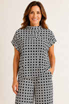 Tillie Top by Jude Connally in Black Rattan print, front view, mock neck, cap sleeves, relaxed boxy silhouette Style #301760

