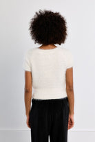 Martha Top by Molly Bracken in White, back view, fitted eyelash knit sweater, crew neckline with frayed edge trim, short cap sleeves with frayed edges, cropped waist length Style # NL45EN