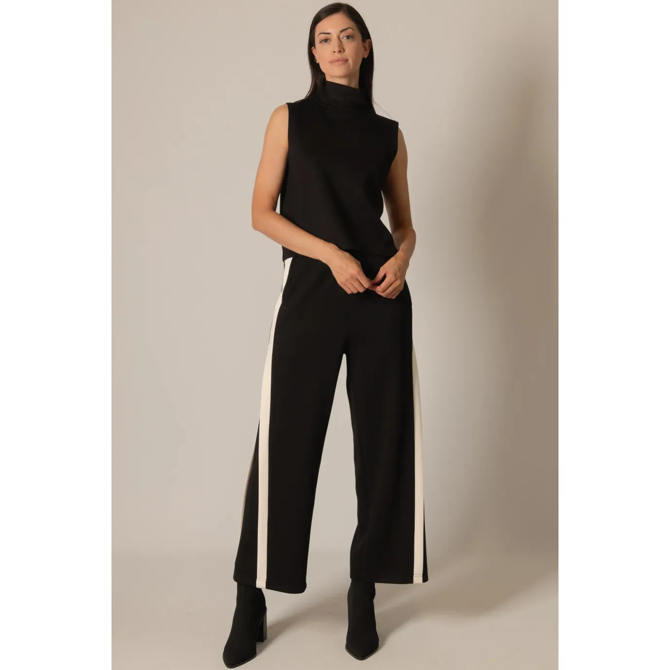 Black Paige top by P Cill, soft modal fabric, sleeveless design, close-up of the smooth, fitted sleeveless top on a neutral background.