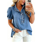The Meade Top by Rosa Clothing, medium-wash denim blouse with ruffled collar and puff sleeves, front view