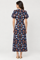  Abby Dress by Sail to Sable in navy geometric floral print, front view showing the tie waist