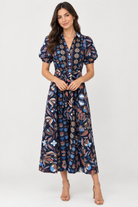  Abby Dress by Sail to Sable in navy geometric floral print, front view showing the tie waist