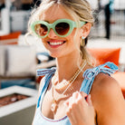Sea Glass Necklace Coconut by Smith and Co. Design — coconut glass bead necklace layered on model
