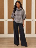 Dorothy Top by Voy in gray-and-ivory houndstooth with a cowl neck, wide sleeves, and deep green trim, front view