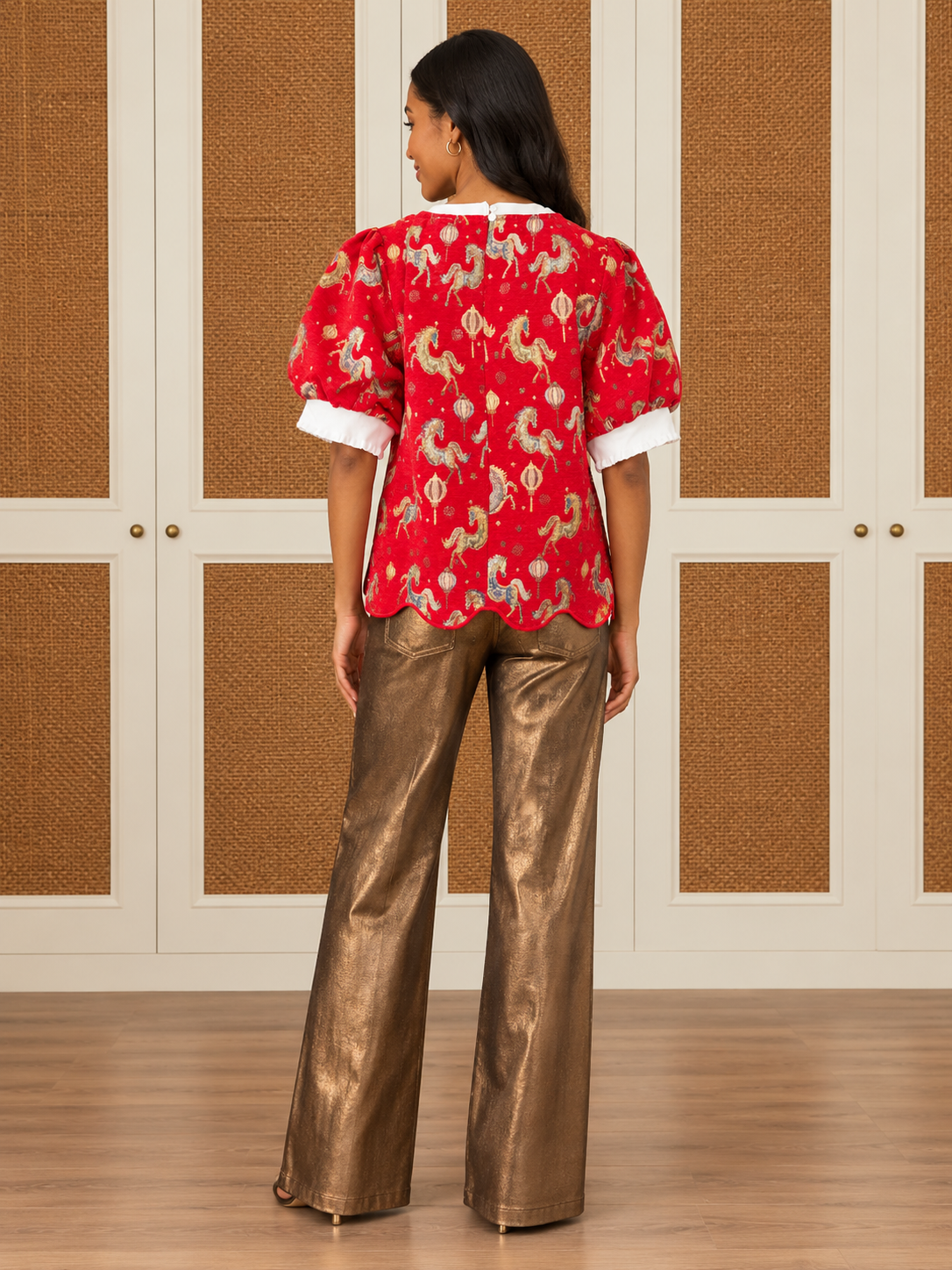 Sandra Top by Voy in red with a horse-and-lantern pattern, ivory neckline, puff sleeves, and scalloped hem, back view