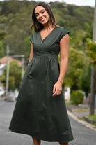 Noah Dress by Wyatt Wylde - olive green V-neck cotton poplin midi dress with fitted waist, front view