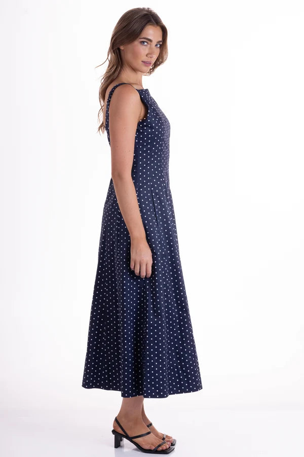 Orson Dress by Wyatt Wylde - navy polka dot sleeveless maxi dress, side view showing full skirt