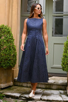 Orson Dress by Wyatt Wylde - navy polka dot sleeveless maxi dress, front view